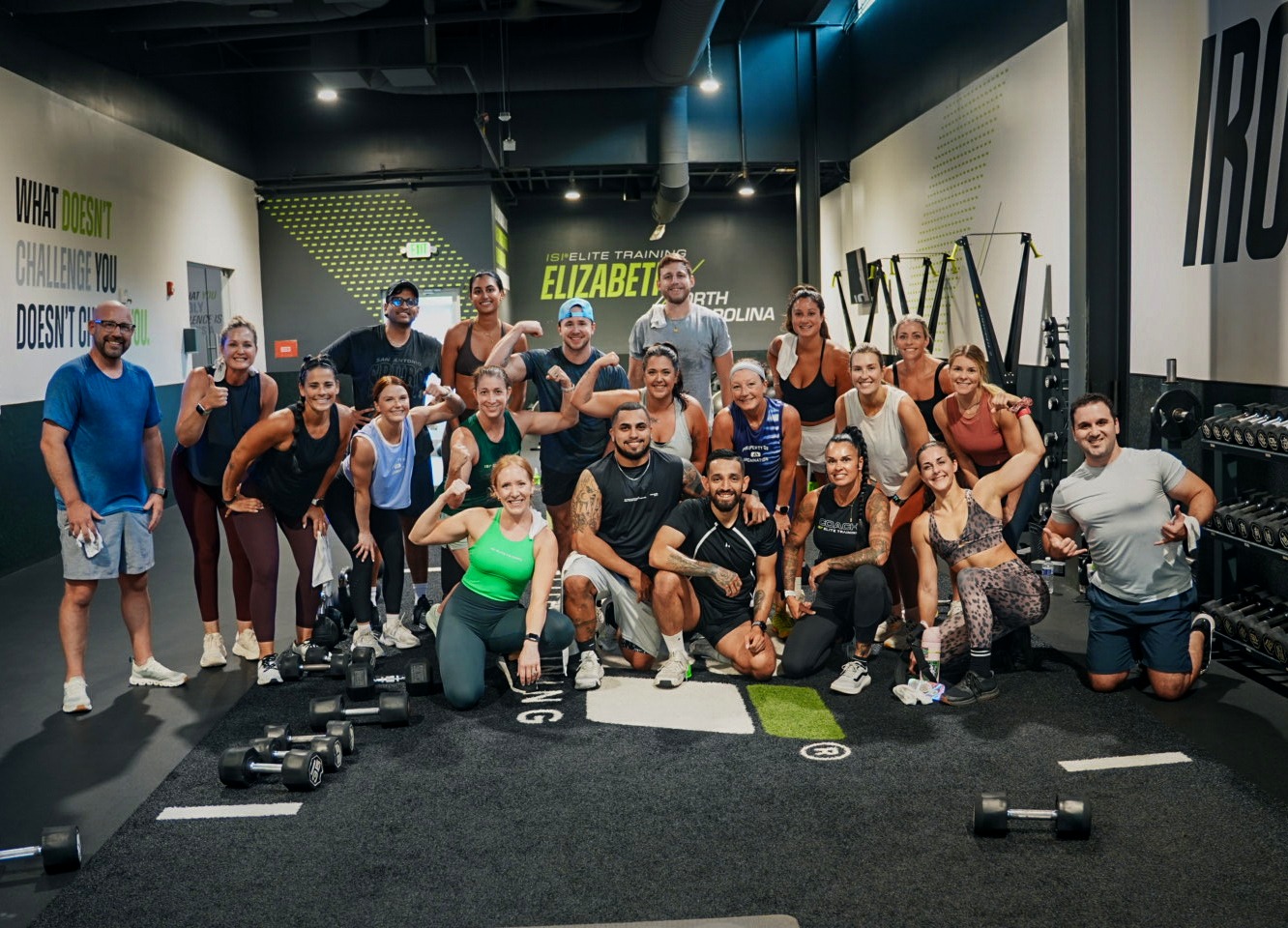 A diverse ISI Elite Training community celebrating after their first workout together